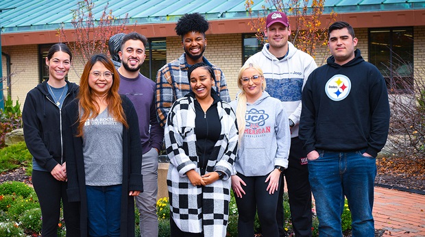 La Roche students pose for a group photo outside the library on campus